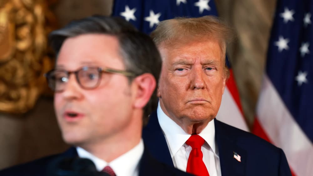 President Donald Trump listens as Speaker of the House Mike Johnson speaks during a press conference on April 12, 2024, in Palm Beach, Fla.