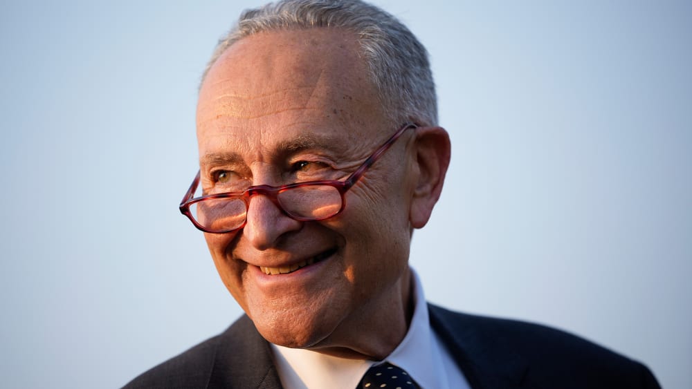 Chuck Schumer smiles.