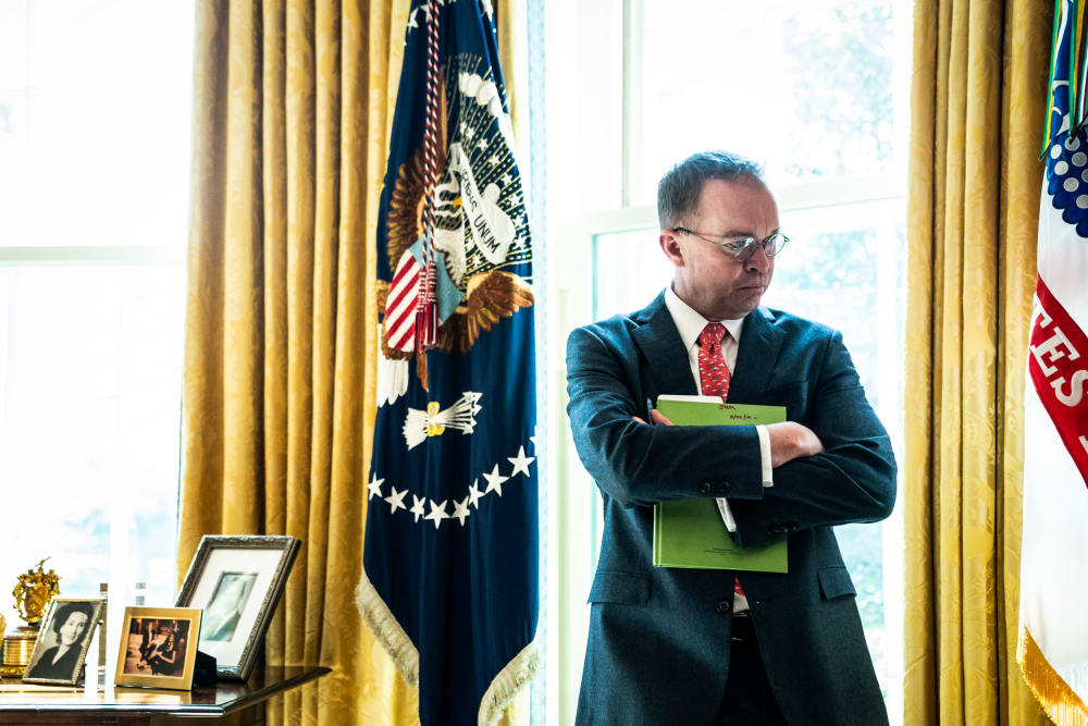 Image: Acting White House Chief of Staff Mick Mulvaney listens in the Oval Office on March 19, 2019.