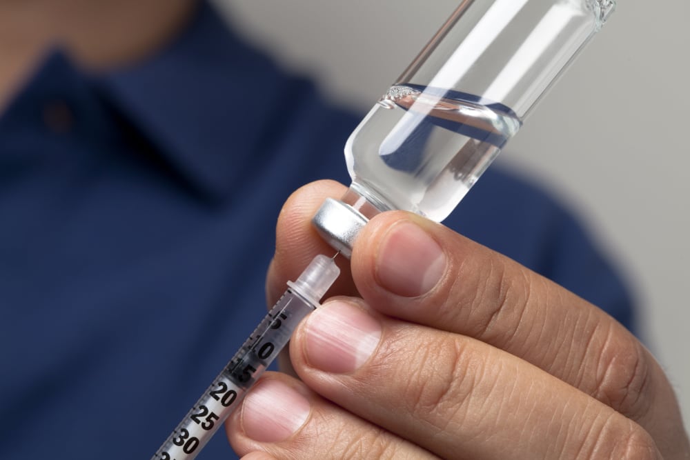 Image: Preparing syringe for insulin shot