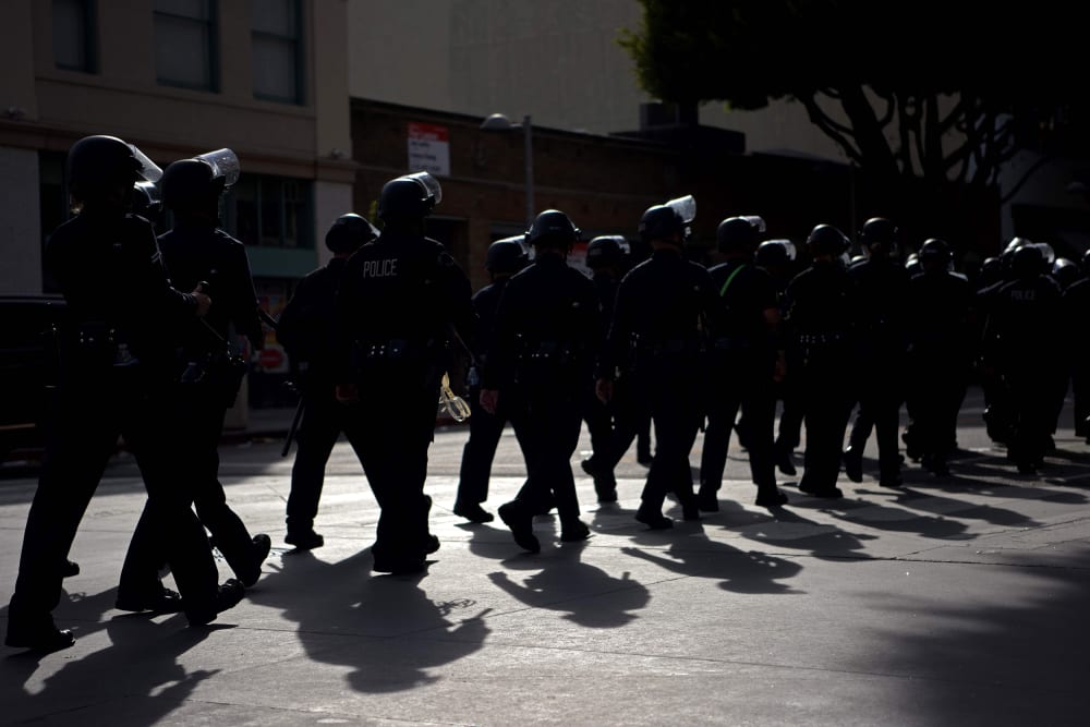 Image: police riot gear march line