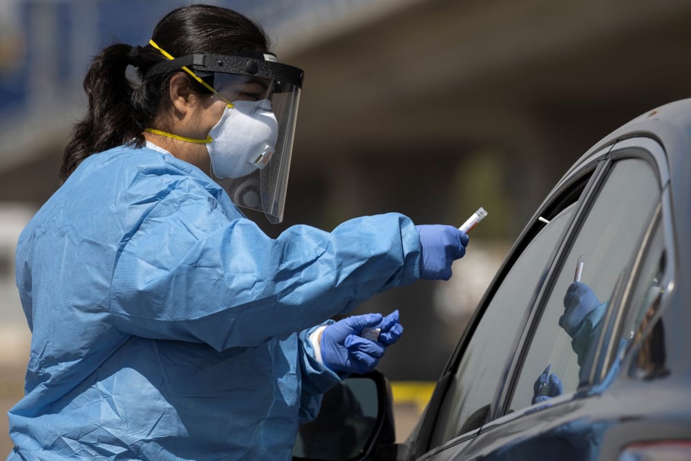 Image: Testing for COVID-19 at a drive-in testing site in San Diego, California