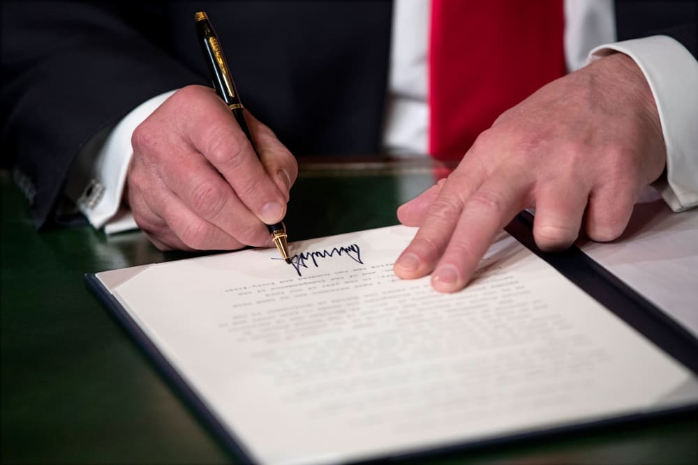 Image: President Donald Trump signs his cabinet nominations into law on Jan. 20, 2017.