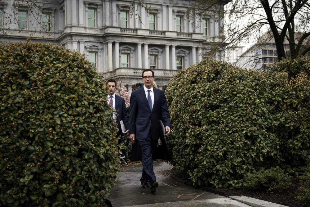 Image: Treasury Secretary Steve Mnuchin leaves a television interview outside of the White House on March 13, 2020.