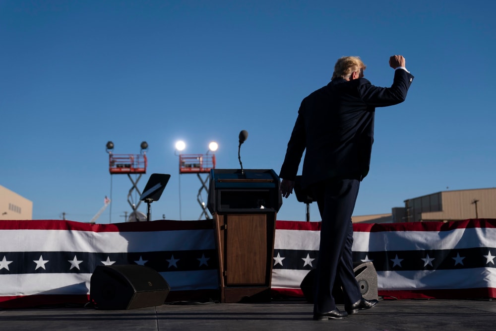 Image: President Donald Trump walks off stage after speaking during a campaign rally at Phoenix Goodyear Airport