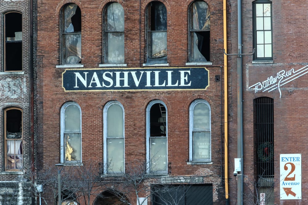 Image: A building in Nashville with broken glass windows after an explosion.