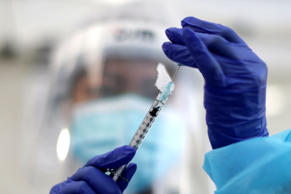 Image: A healthcare worker prepares a Pfizer coronavirus disease (COVID-19) vaccination in Los Angeles