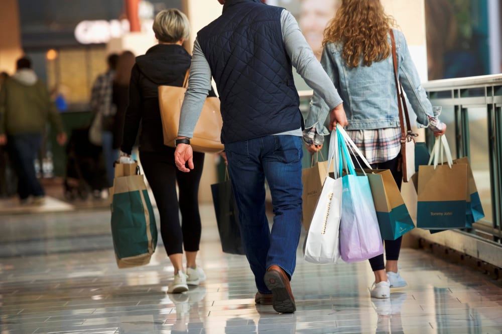 Image: FILE PHOTO: Shoppers carry bags of purchased merchandise at the King of Prussia Mall, United States' largest retail shopping space, in King of Prussia