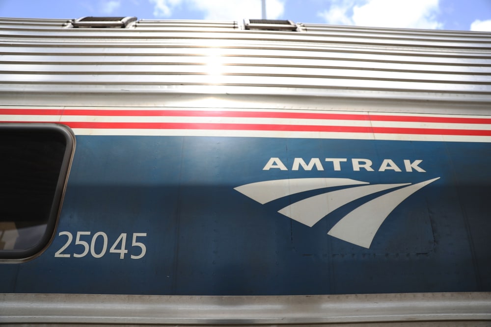 Image: An Amtrak train waits at a station