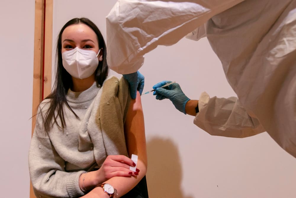 Image: A young woman is vaccinated with the Pfizer-BioNTech vaccine at SZentrum on March 11, 2021 in Schwaz, Austria.