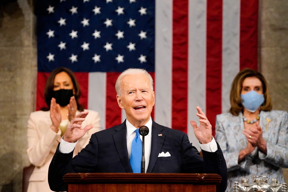 Image: Vice president Kamala Harris and Speaker of the House Nancy Pelosi applaud as President Joe Biden addresses a joint session of Congress at the U.S. Capitol on April 28, 2021.