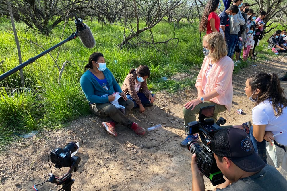 NBC News correspondent Julia Ainsley speaks with migrants at the southern border in July 2021.