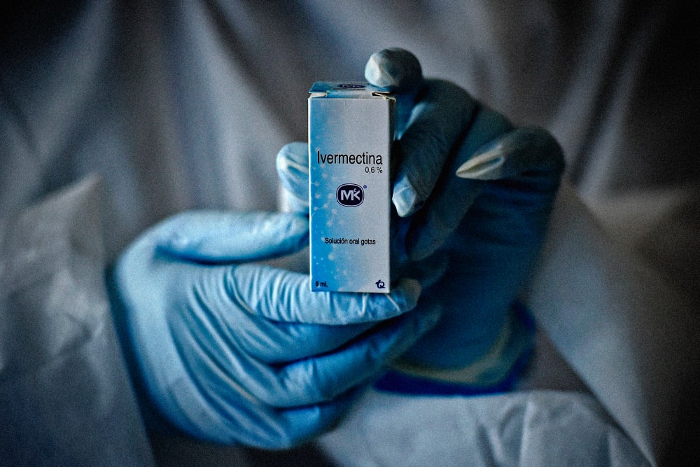 Image: A health worker holds a bottle of Ivermectin in Cali, Colombia, on July 21, 2020.