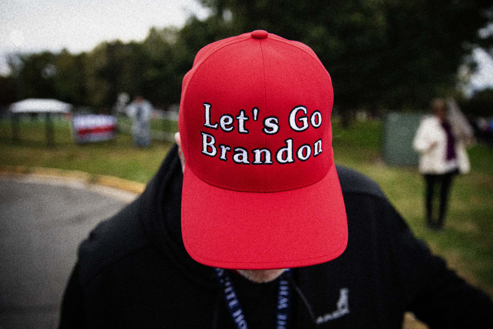 Image: A supporter of former President Donald Trump wears a "Let's Go Brandon" hat before a campaign event in Arlington, Va., on Oct. 26, 2021.