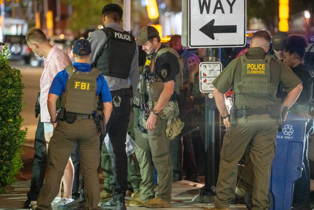 FBI and Border Patrol officers arrest a man