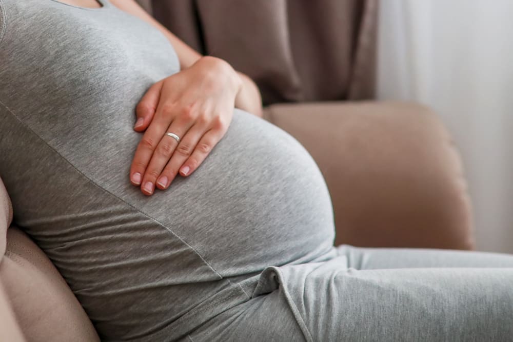 Pregnant woman on couch