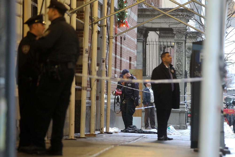 Police investigate the scene of a fatal shooting at 202 West 58th Street in Manhattan on Dec. 10, 2012 in New York City.