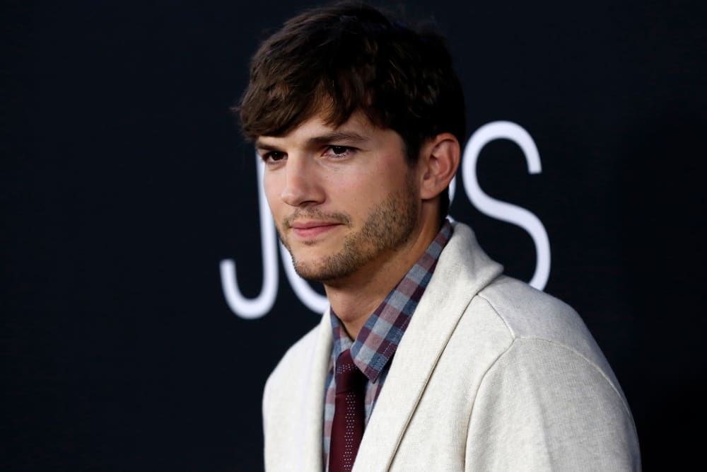 Cast member Ashton Kutcher poses at the premiere of "Jobs" in Los Angeles, Calif on Aug. 13, 2013.