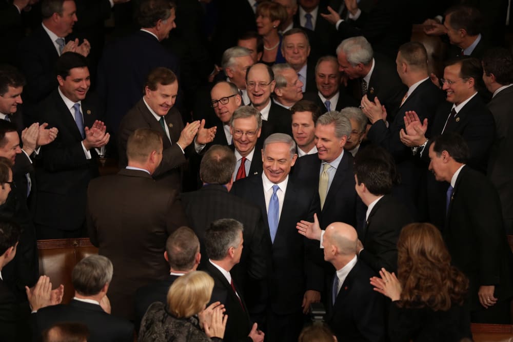 Israeli Prime Minister Benjamin Netanyahu is greeted by members of Congress as he arrives to speak during a joint meeting of the United States Congress at the Capitol March 3, 2015 in Washington, DC. (Photo by Chip Somodevilla/Getty)