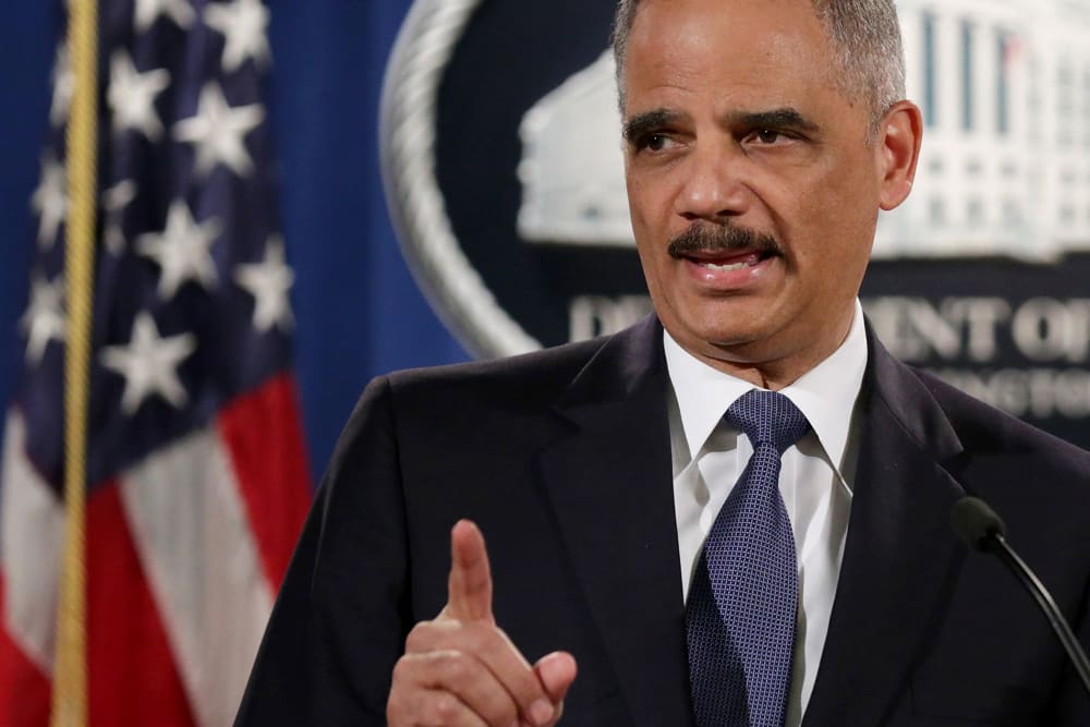 Attorney General Eric Holder delivers remarks about the Justice Department's findings related to two investigations in Ferguson, Mo. at the Robert F. Kennedy Department of Justice Building on March 4, 2015 in Washington, DC.