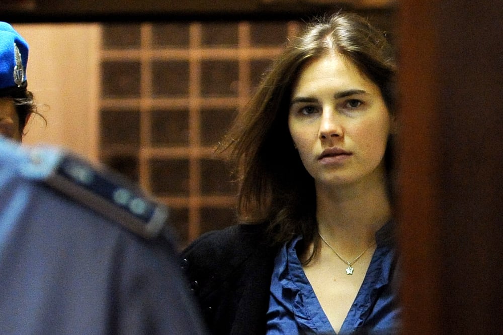 Amanda Knox (R), US national accused of the 2007 murder of her housemate Meredith Kercher arrives at the court during the resumption of her appeal trial in Perugia on Sept. 30, 2011. (Photo by Tiziana Fabi/AFP/Getty)