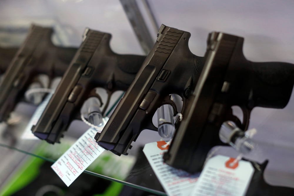 Handguns are seen for sale in a display case. (Photo by Jim Young/Reuters)