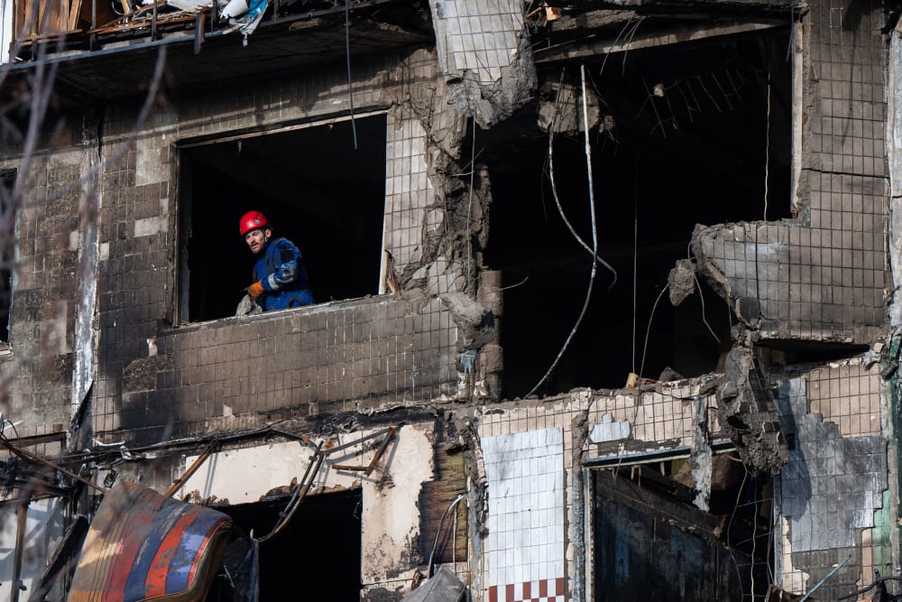 First responders operate at one of the buildings damaged by Russia's drone attack in Kyiv, Ukraine.