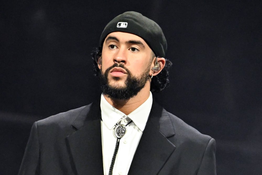 Bad Bunny stands onstage