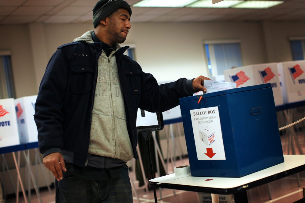 A voter drops off a provisional ballot at the Board of Elections in downtown Cleveland.