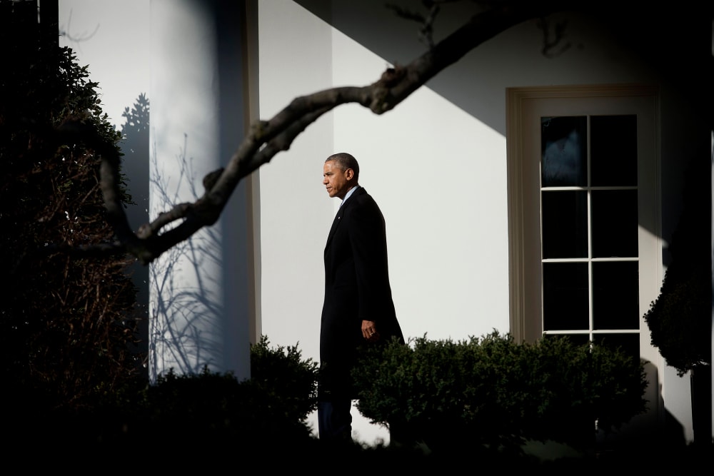 President Barack Obama walks out of the Oval Office of the White House in Washington, Feb. 7, 2014.