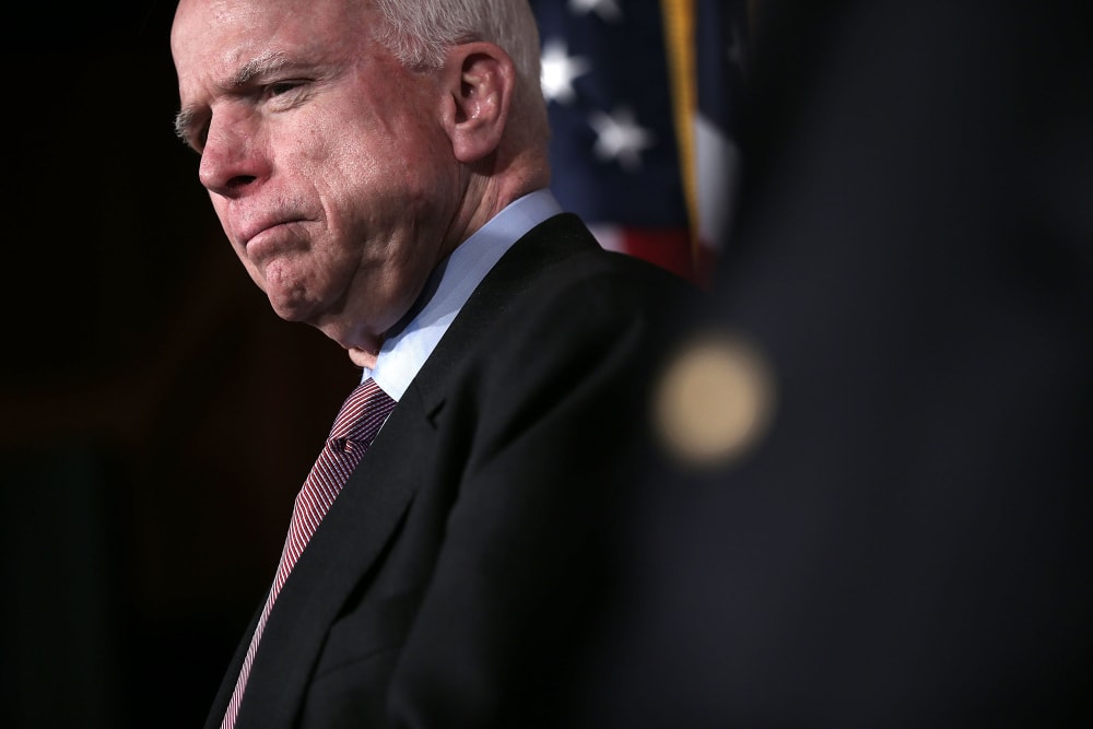 U.S. Senator John McCain (R-AZ) listens during a news conference on the terror attack that killed four Americans in Benghazi Feb. 14, 2013 on Capitol Hill in Washington, DC. (Photo by Alex Wong/Getty)