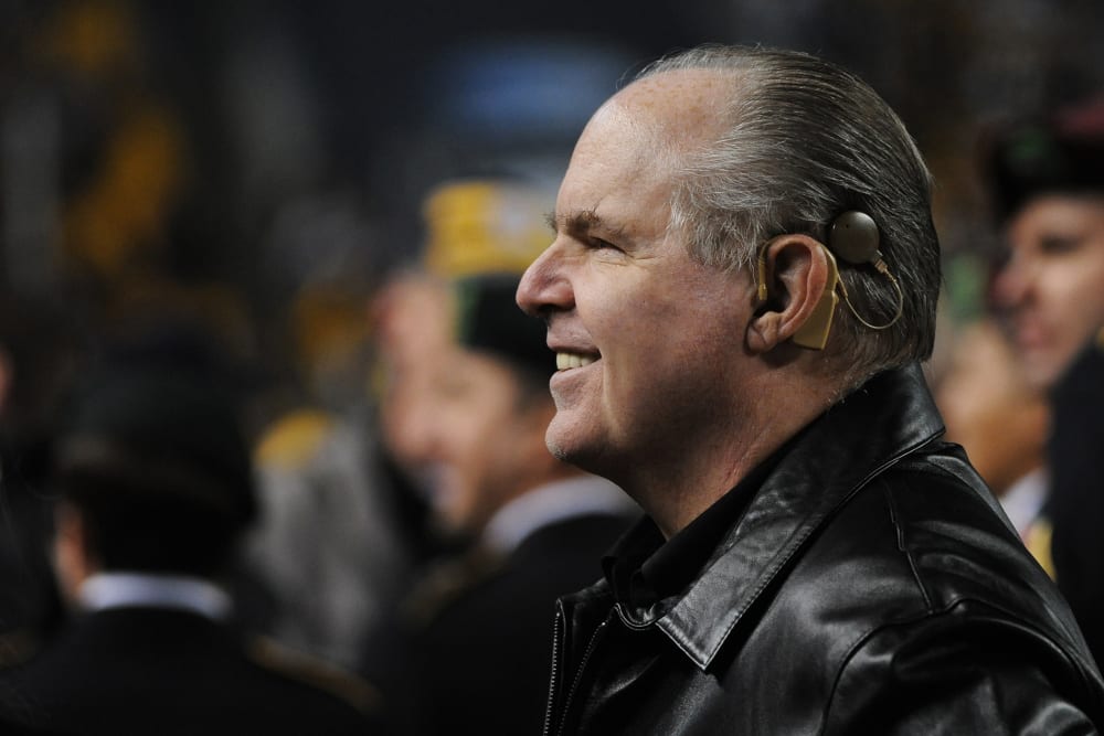 Rush Limbaugh looks on from the sideline before a Baltimore Ravens game, Nov. 6, 2011.
