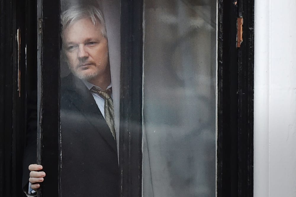 This file photo taken on Feb. 05, 2016 shows WikiLeaks founder Julian Assange coming out on the balcony of the Ecuadorian embassy to address the media in central London. (Photo by Ben Stansall/AFP/Getty)