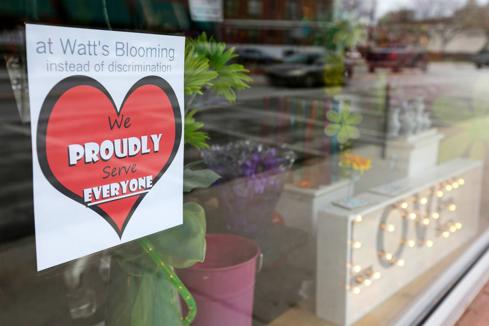A window sign on a downtown Indianapolis florist, March 25, 2015, shows it's objection to the Religious Freedom bill passed by the Indiana legislature. (Photo by Michael Conroy/AP)