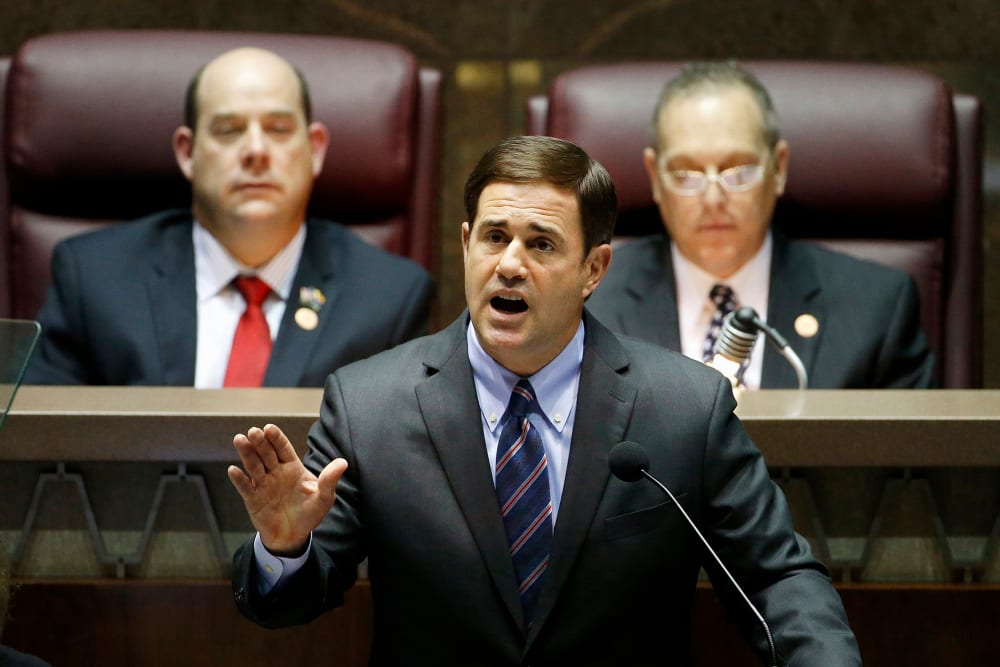 Arizona Republican Gov. Doug Ducey, front, gives his state-of-the-state address on Jan. 12, 2015, in Phoenix. (Photo by Ross D. Franklin/AP)