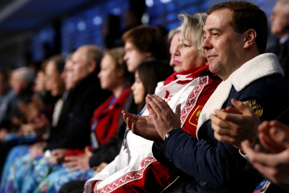 Russia's Prime Minister Dmitry Medvedev (R) attends the opening ceremony of the 2014 Sochi Winter Olympics, Feb. 7, 2014