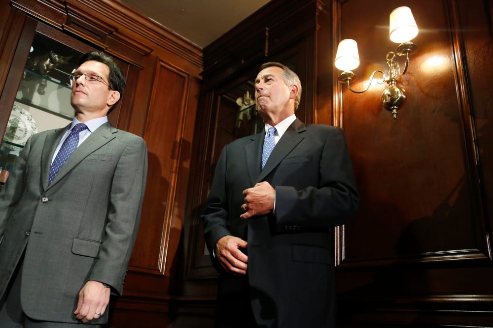 U.S. House Majority Leader Eric Cantor (R-VA) (L) and House Speaker John Boehner (R-OH) (R) stand together at a news conference, Oct. 23, 2013, in Washington.