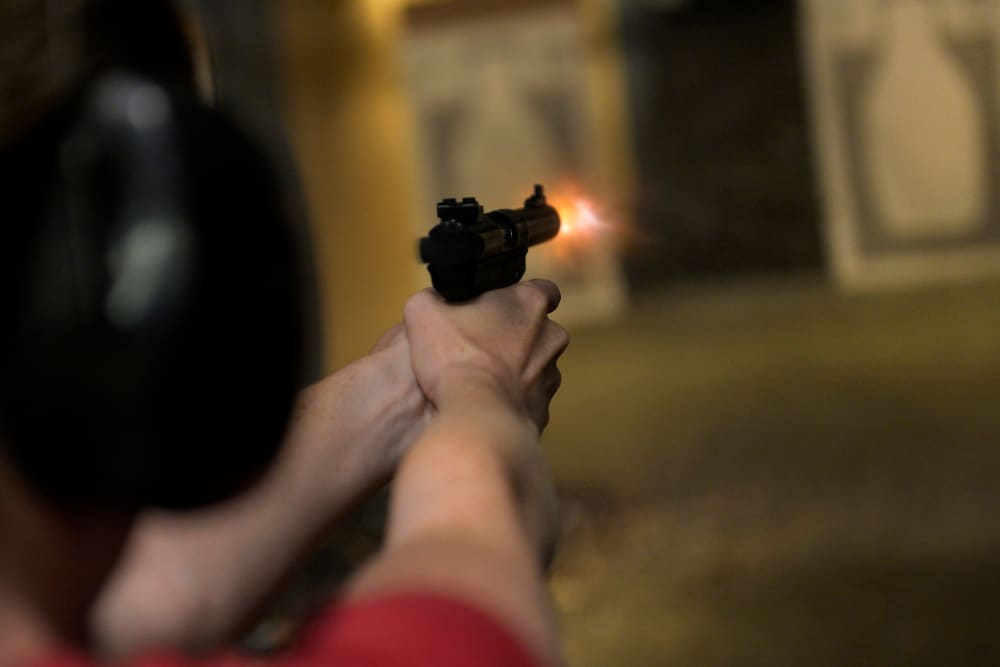 A woman fires her handgun during a Multi-State Concealed Carry class at a shooting range in Centennial, CO July 27, 2013.