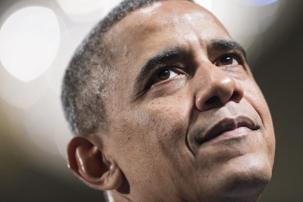 US President Barack Obama pauses while speaking during the Democratic Issues Conference in Cambridge, Maryland, Feb. 2014.