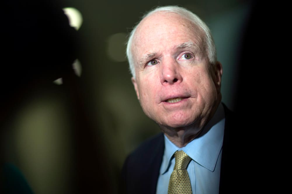 Senator John McCain (R-AZ) speaks to the media after leaving the Senate floor in Washington, D.C., U.S., on Feb. 12, 2014.