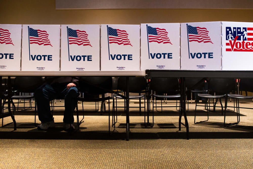 A voter casts their ballot at a polling place in Nashua, N.H., on Feb. 9, 2016. (Photo by Cassi Alexandra/For The Washington Post/Getty)