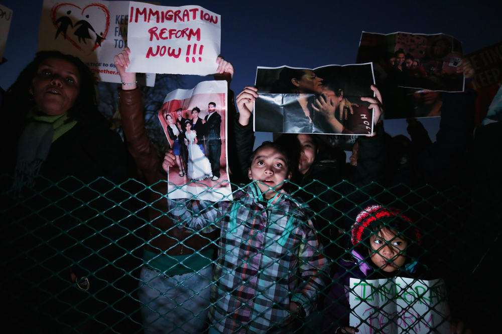 A handful of immigration reform proponents demonstrate at the U.S. Capitol in Washington, DC, Dec. 3, 2013.