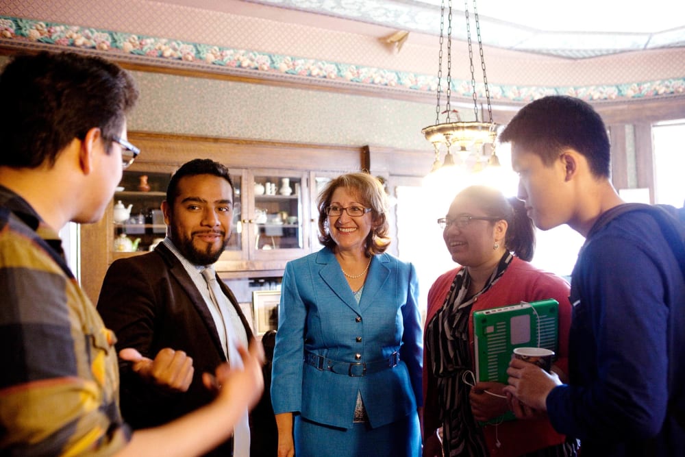 Eloise Gomez Reyes (center) talks to campaign volunteers at her law office, which is currently acting as her campaign headquarters, in Colton, CA on Feb. 11, 2014.