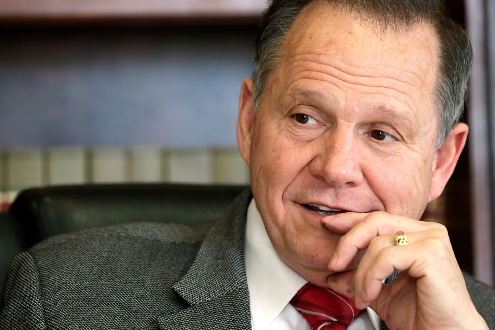 In this Oct. 24, 2012 file photo, former Chief Justice Roy Moore poses for a photo in his Montgomery, Ala., office. (Photo by Dave Martin/AP)
