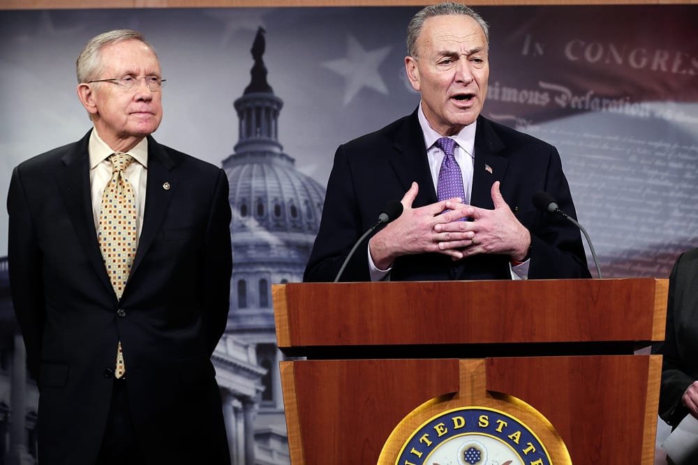 Sen. Chuck Schumer and Senate Majority Leader Harry Reid answer questions during a press conference Jan. 9, 2014.