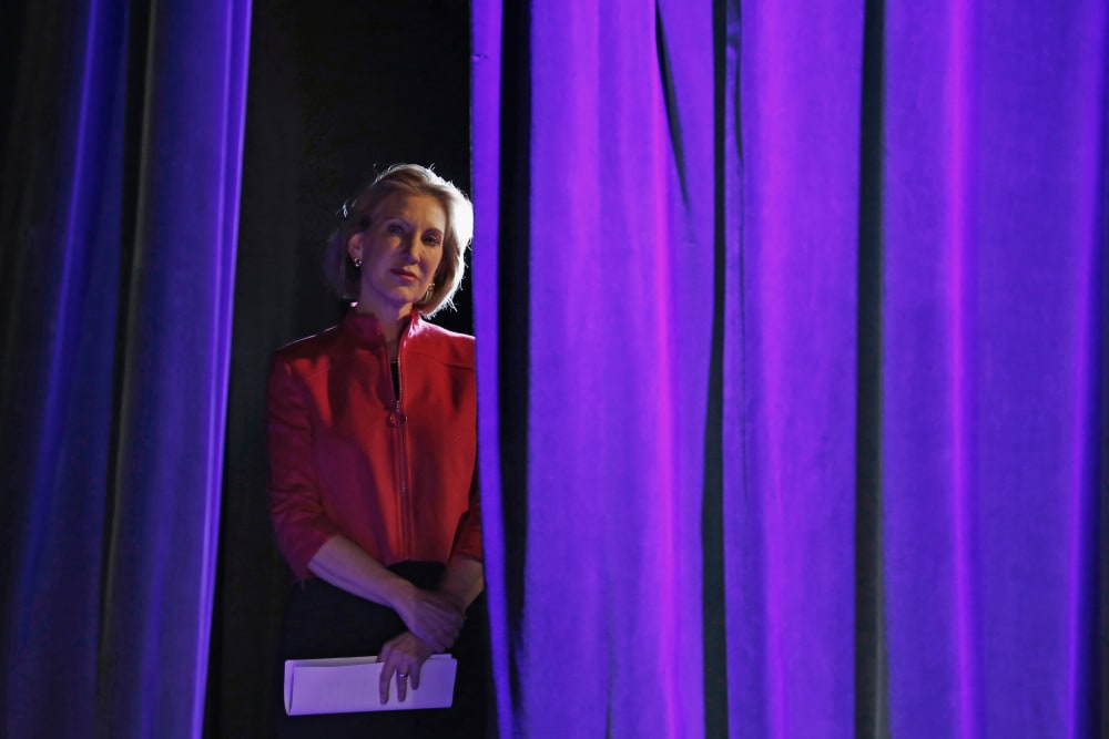 Former Hewlett-Packard Co Chief Executive Officer Carly Fiorina listens to her introduction from the side of the stage at the Freedom Summit in Des Moines, Ia., Jan. 24, 2015. (Photo by Jim Young/Reuters)