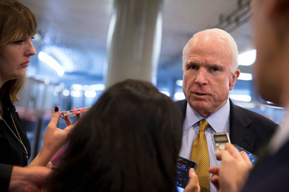 In this Oct. 20, 2015 photo Sen. John McCain, R-Ariz., talks to reporters near the subway on Capitol Hill in Washington, D.C. (Photo by Carolyn Kaster/AP)