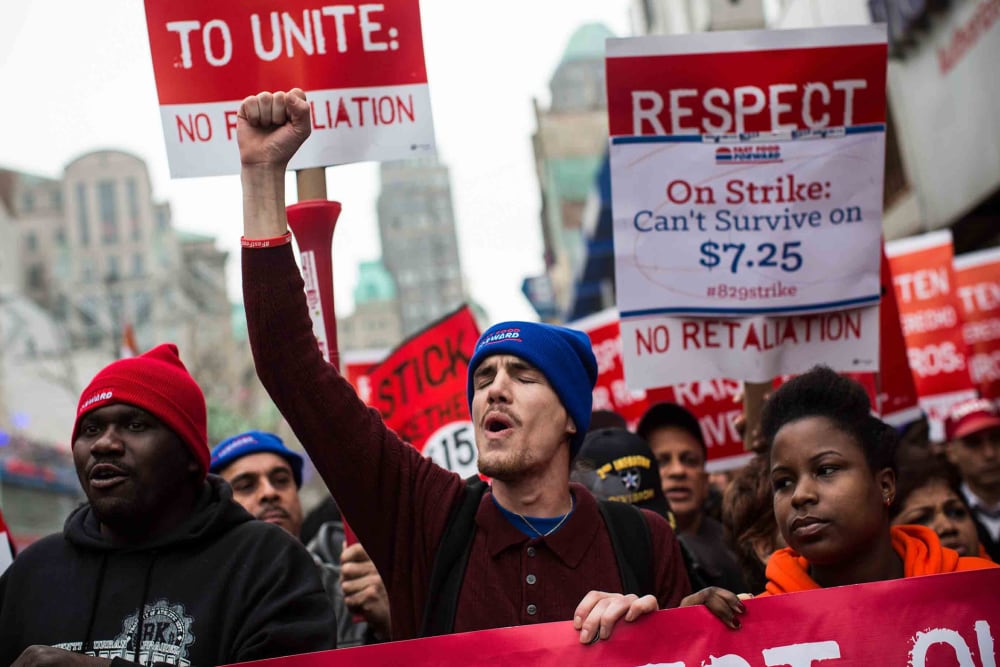 Protesters rally outside of a Brooklyn Wendy's in support of raising fast food wages from $7.25 per hour to $15.00 per hour, Dec. 5, 2013.