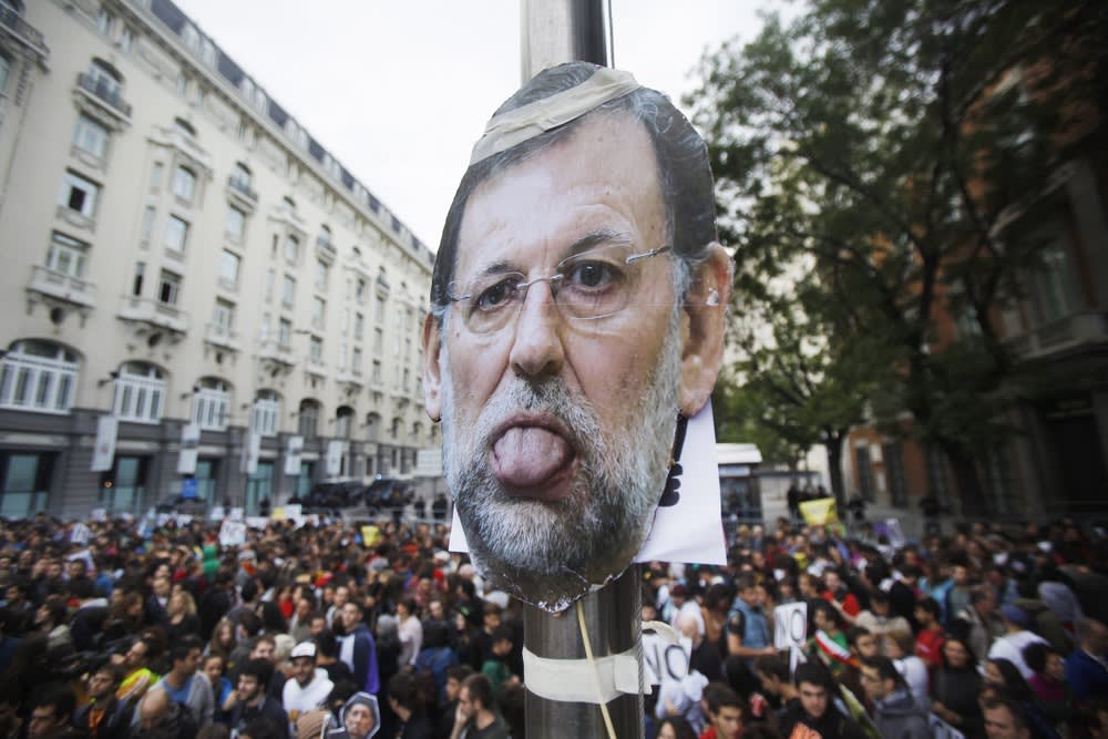 A picture of Spanish Prime Minister Mariano Rajoy is seen during the demonstration in Madrid.