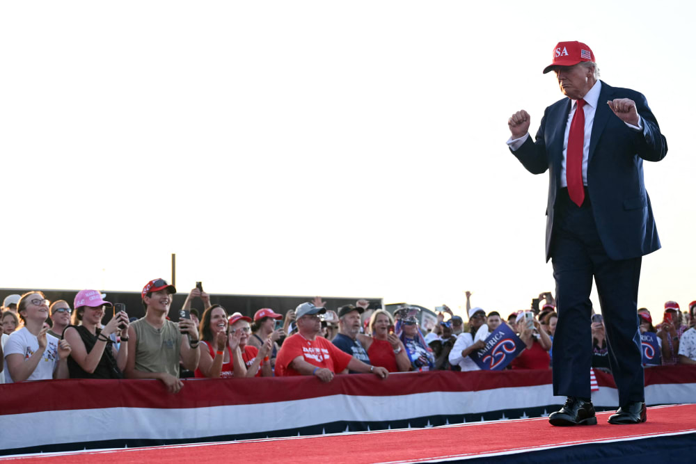 President Donald Trump dances as he leaves the stage in Des Moines, I.A.